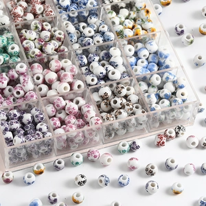 Assorted Jingdezhen floral ceramic beads for DIY jewelry making in a plastic organizer box