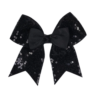 Detailed view of the layered black sequin bow hair clip with textured ribbon center