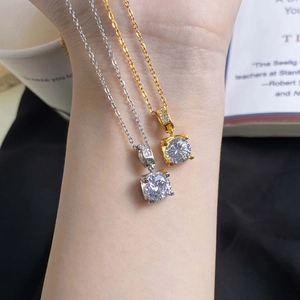 Elegant four-prong zircon necklace in gold and silver finish with cross chain