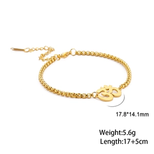 Detail of gold titanium steel Om pendant bracelet with box chain and lobster clasp