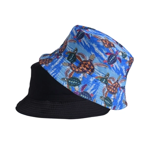 Double-sided bucket hat in solid black and vibrant blue sea turtle print for sun protection