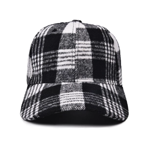 Front view of black and white plaid wool baseball cap with a curved brim for winter