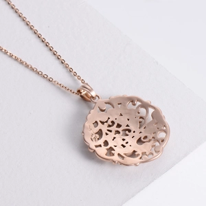 Rose gold stainless steel necklace with round hollow flower pattern pendant on stone