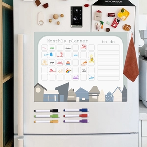 Magnetic monthly planner set on a fridge with colorful markers and activity icons