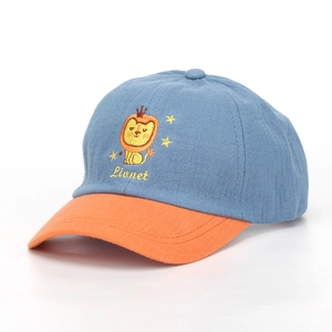 Detail of kids baseball cap featuring blue and orange contrast with lion embroidery