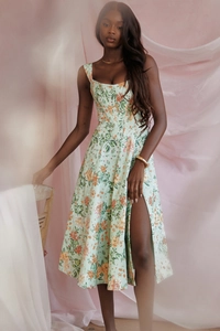 Detail of floral print on mint green dress with side slit and square neckline design