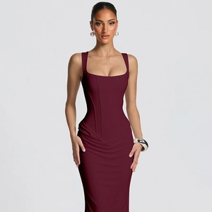 Detail of burgundy bodycon evening dress featuring corset boning and U-neckline finish