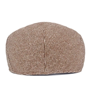 Detail of vintage brown herringbone wool blend fabric on classic newsboy hat back view