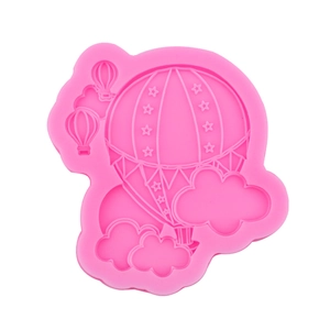 Pink silicone mold featuring hot air balloons and clouds for DIY fondant cake decorating