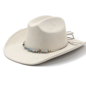 Vintage beige faux suede western cowboy hat with decorative beaded band and wide brim