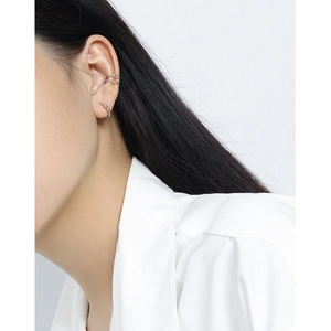 Minimalist S925 sterling silver olive bead ear cuff set worn by model in bright silver