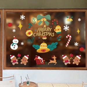 Christmas window static stickers with Santa, snowman, and reindeer on a glass pane