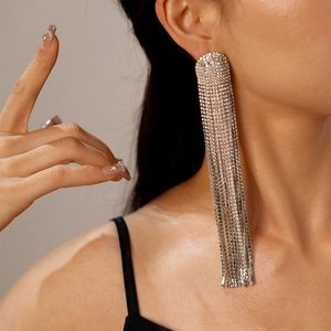 Elegant multi-layer tassel earrings with sparkling rhinestones worn by a fashion model