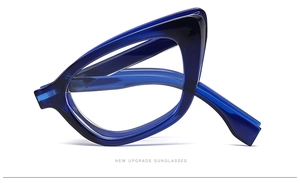 Detail view of wide temples and hinges on translucent cat eye sunglasses frames