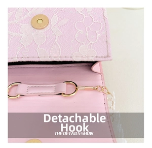 Detail showing the magnetic buckle and floral lace texture on pink girls handbag