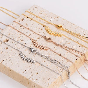 Irregular vertical bar necklaces in gold, rose gold, and silver finishes with stones