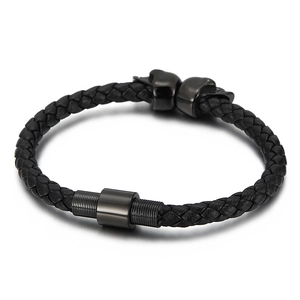 Men's black woven leather bracelet with stainless steel skull beads and magnetic clasp