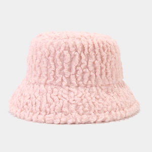 Close-up of soft pink plush bucket hat showing thick faux fur texture and fuzzy material