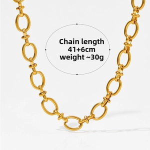 Close-up of a chunky gold-plated chain necklace featuring large oval links and a modern toggle clasp