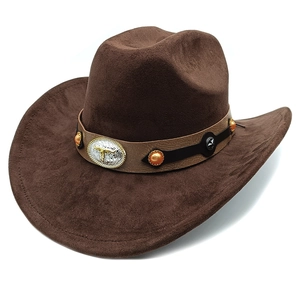Detail of faux suede cowboy hat showing bull head metal buckle and beaded leather band