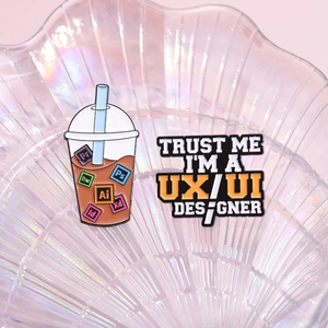 Creative UX UI designer pins set with bubble tea Adobe software icons and enamel trust me badge