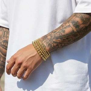 5-piece set of 18K gold plated bead stretch bracelets with polished metallic finish
