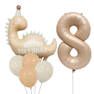 Close-up of matte cream dinosaur and number 8 foil balloon set for birthday party