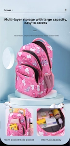 Detail of pink school bag interior with spacious storage and cartoon bunny design