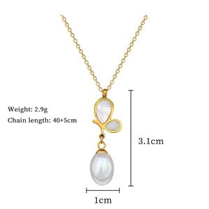 Detail view of butterfly necklace with pearl and gold finish, dimensions 3.1cm pendant