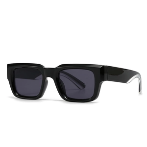 Classic square black thick frame sunglasses with dark grey lenses in a 45-degree side view