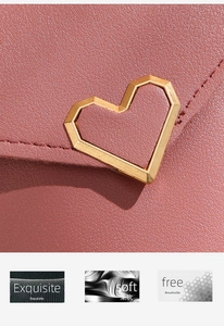 Detailed view of the soft lychee texture leather with an exquisite heart-shaped gold buckle