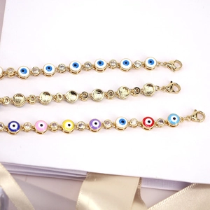 Bohemian gold evil eye bracelet with colorful enamel beads and sparkling zircon accents
