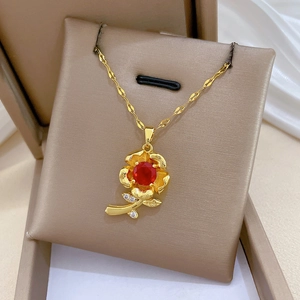 Detail view of titanium steel rose necklace with red gemstone and clear CZ crystals