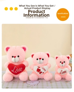 Three sizes of pink teddy bears with embroidered Love hearts on warm background
