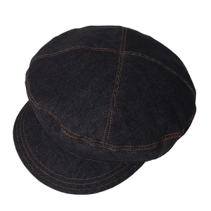 Dark blue denim baker boy hat with contrast orange stitching and vintage newsboy design