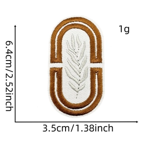 Detail of bohemian leaf embroidery patch with 6.4cm height and 3.5cm width measurements