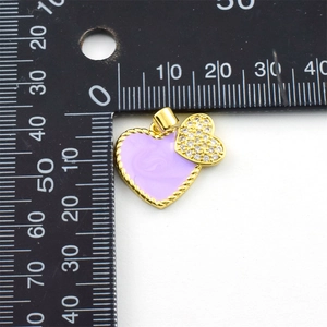 Detail view of purple enamel heart pendant with gold twist border and cubic zirconia accents