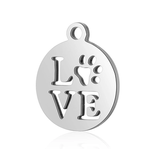 Macro shot of silver stainless steel round pendant with hollowed LOVE and paw print design