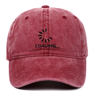 Close-up of Loading embroidery on a burgundy washed cotton vintage baseball cap