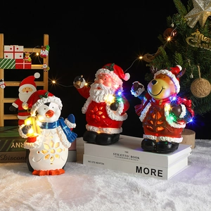 Lighted Christmas resin figurines set with Santa, reindeer and penguin with LED effects
