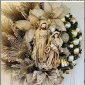Christmas Nativity scene wreath with gold flowers, pine needles and festive bow