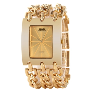 Detail of gold chain strap and square dial of G&D quartz watch with metallic link texture