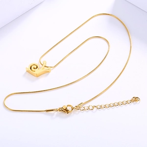 Minimalist golden snail pendant necklace made of stainless steel on white background
