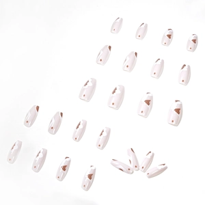 Cappuccino cow print coffin press-on nails with white and brown artistic patterns