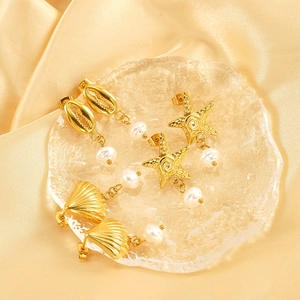 Golden 18K stainless steel ocean-themed earrings featuring sea stars and baroque pearls