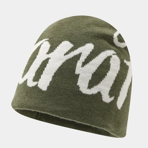 Detailed knit texture of olive green street style beanie with white jacquard letters
