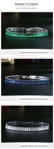 Detailed view of tennis bracelets with emerald green, blue, and clear zircon stones