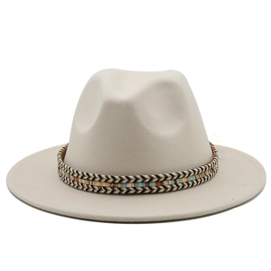 Close-up of cream wool jazz hat with a colorful ethnic woven band on white background