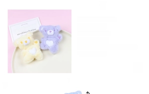 Detailed view of handmade 9x10cm plush bear keychains with hearts in yellow and purple