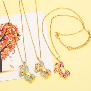 Detailed view of cute bear necklaces with sky blue, lilac, and rose red crystal inlay